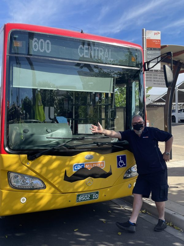 CDC Staff Standing In Front Of A CDC Mildura Bus With Movember Moustaches Scaled
