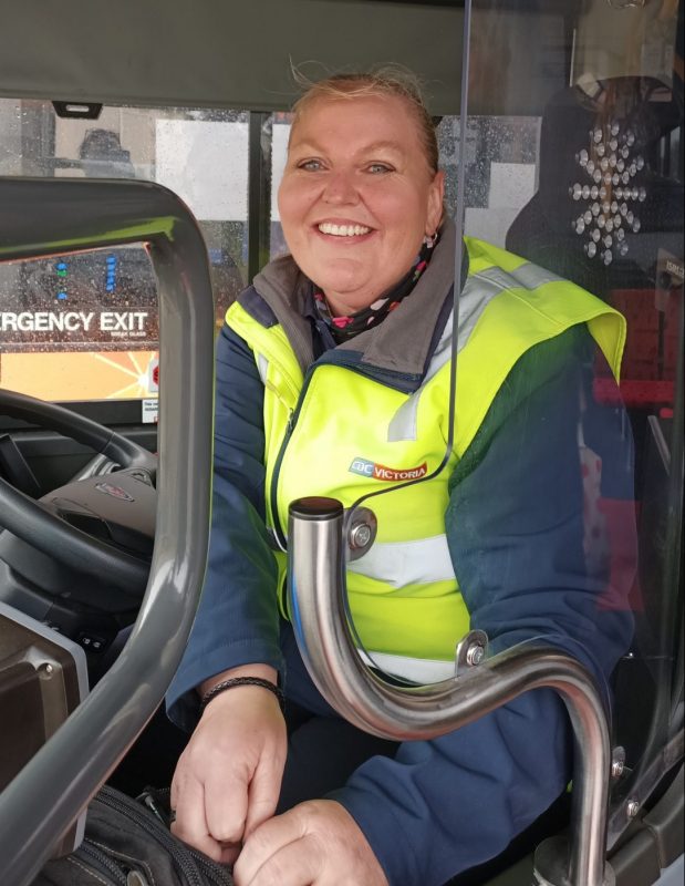 Friendly bus driver smiling